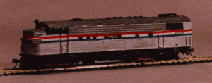 Figure 4: One of my kit-bashed FL9's painted in Amtrak Phase III.