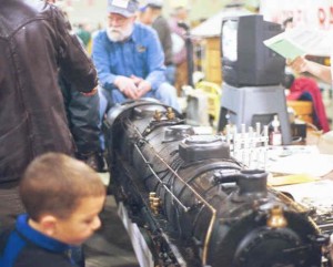 Small railfan checking out a really big model locomotive