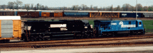 A ConRail GE and a NS SD40 passing through Selkirk Yard